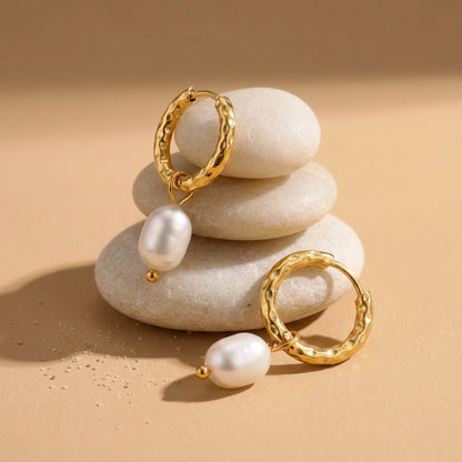 18K gold plated twisted rope pearl drop hoop earrings, still life on smooth stones | SKU: AUR-TWPRLH-G