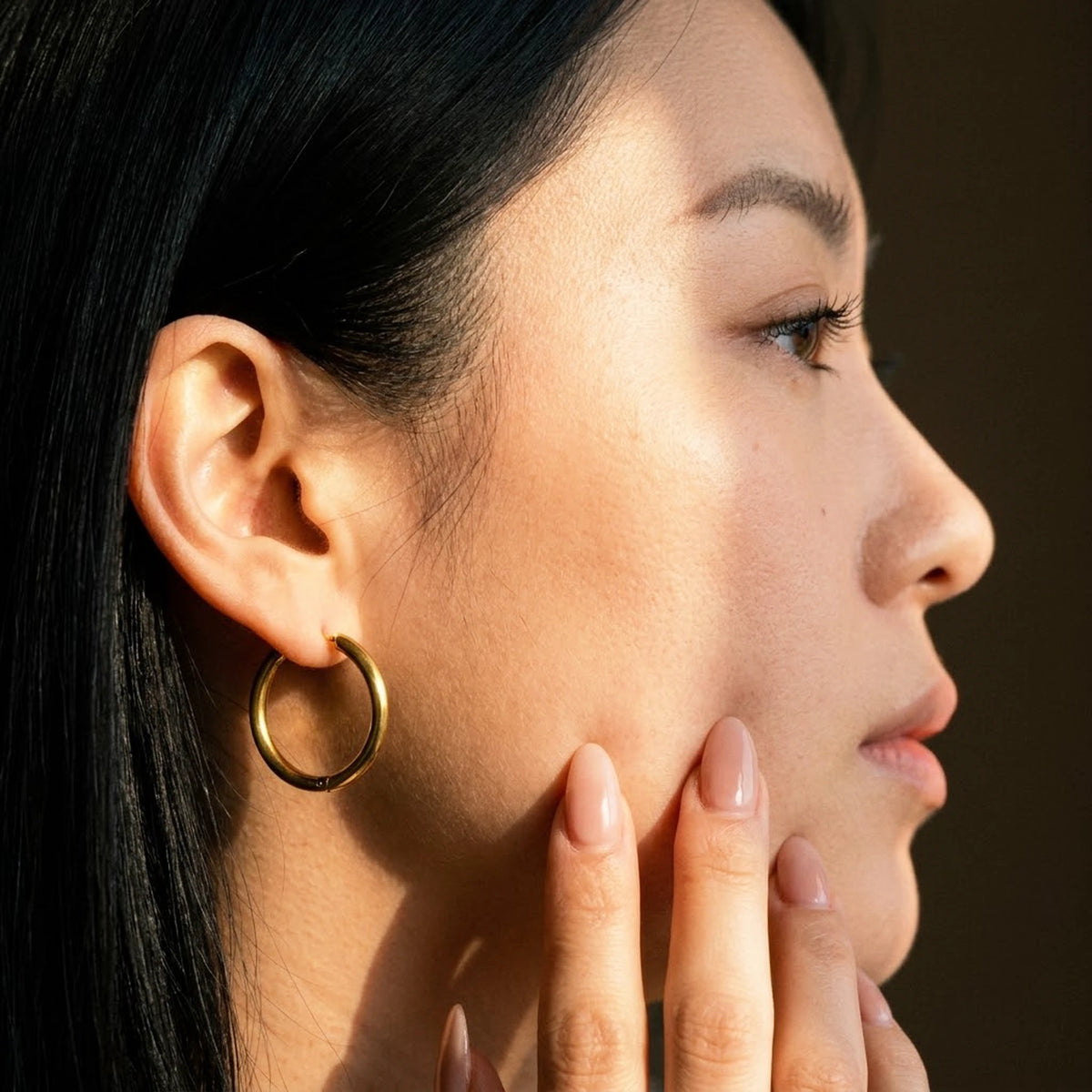 18K gold plated waterproof hoop earrings, worn, close detail in warm light | SKU: AUR-CLSHOP-G