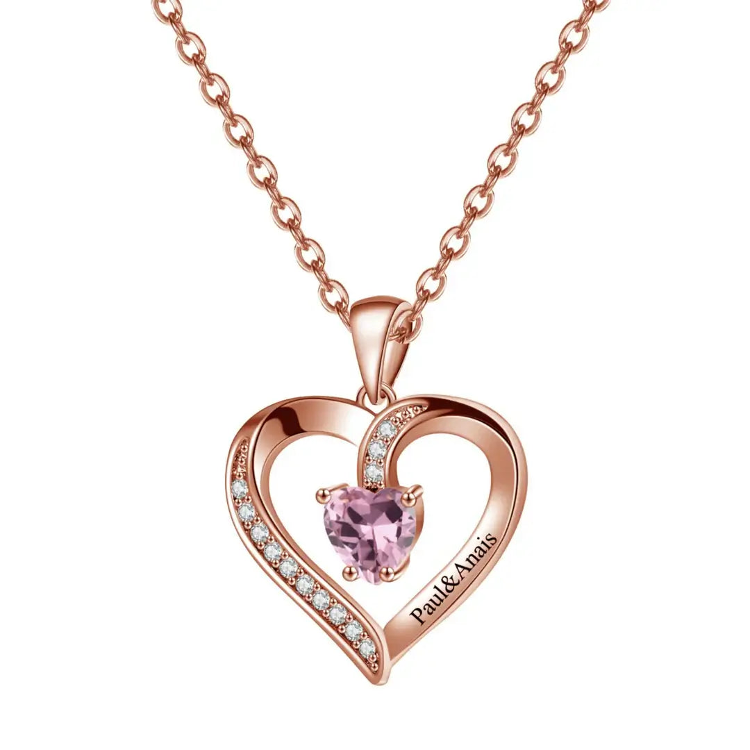 Heart Birthstone Necklace by AUREATE featuring a pink gemstone in a rose gold heart design.