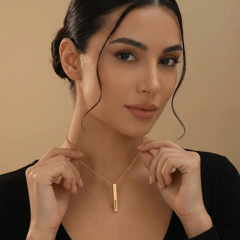 Woman wearing a 3D Bar Engraved Necklace by AUREATE, showcasing its unique personalized design.