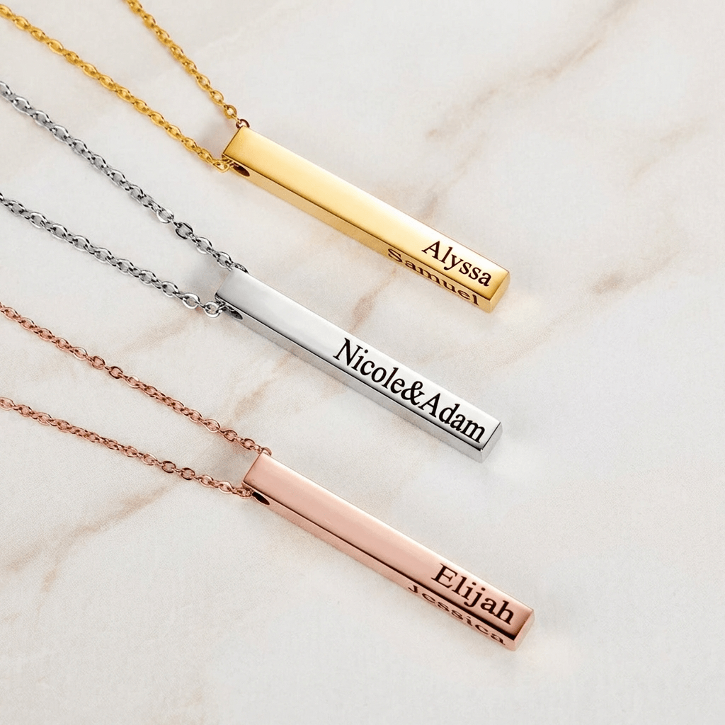 3D Bar Engraved Necklace by AUREATE featuring personalized names on gold, silver, and rose gold finishes.