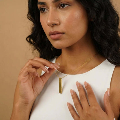 Model wearing AUREATE 3D Bar Engraved Necklace, showcasing its elegant design and personalization options.
