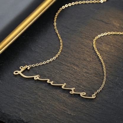 AUREATE Petit Name Necklace in gold featuring a personalized name, perfect minimalist accessory for any occasion.
