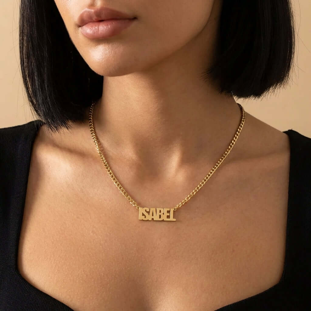 Block Name Necklace with Cuban Chain by AUREATE worn by a model, showcasing a personalized gold name necklace.