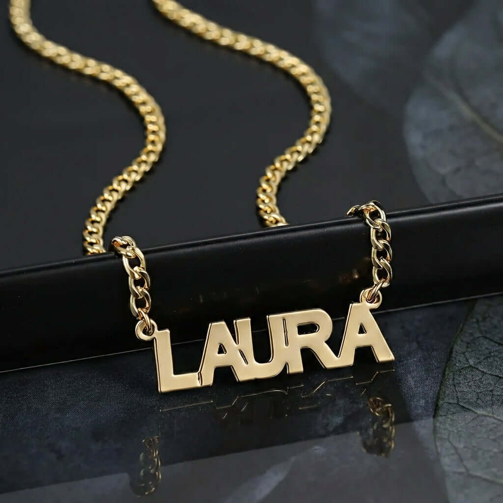 Block Name Necklace with Cuban Chain featuring gold nameplate 'LAURA' from AUREATE.
