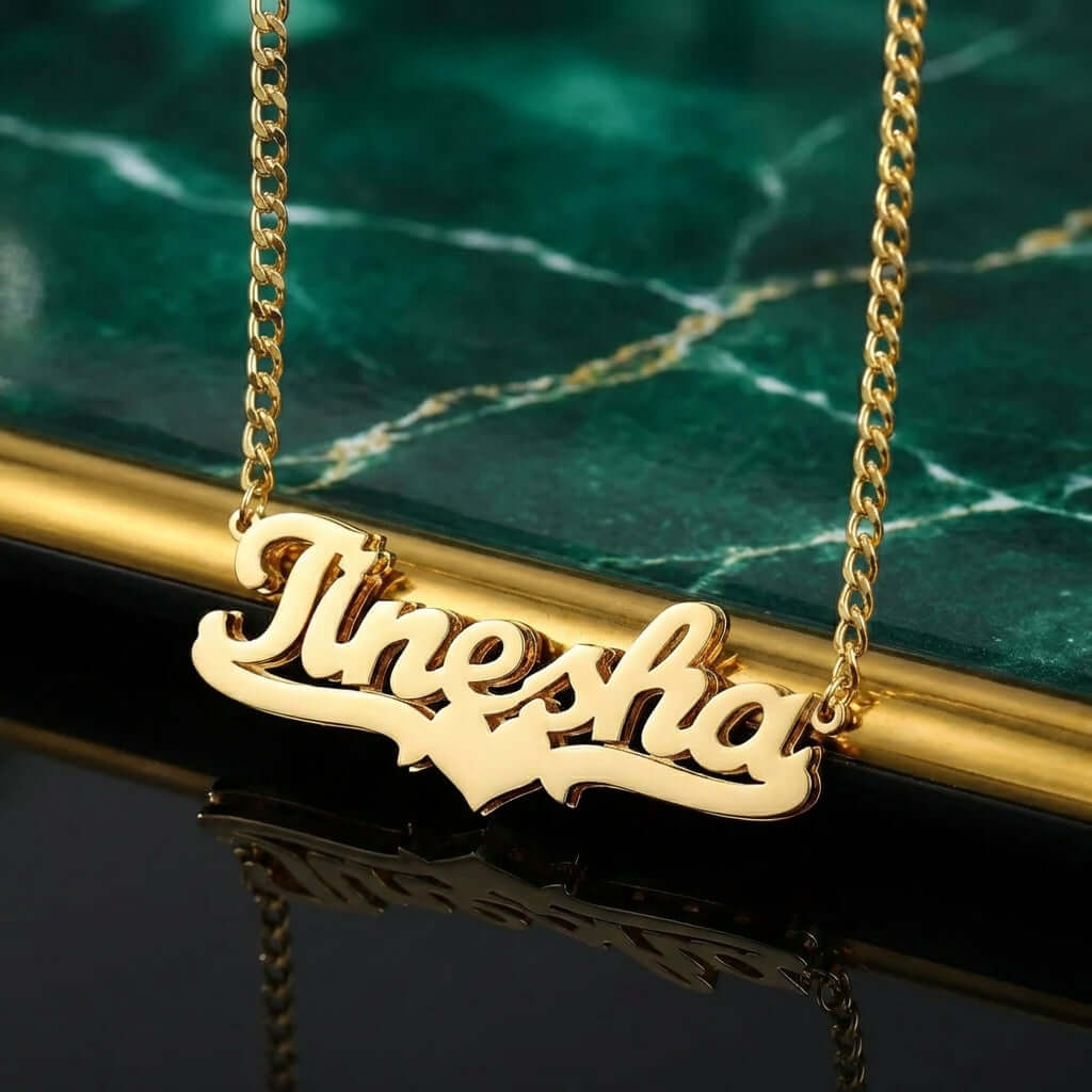 Double Plated Heart Name Necklace with Cuban Chain featuring a personalized name in gold.