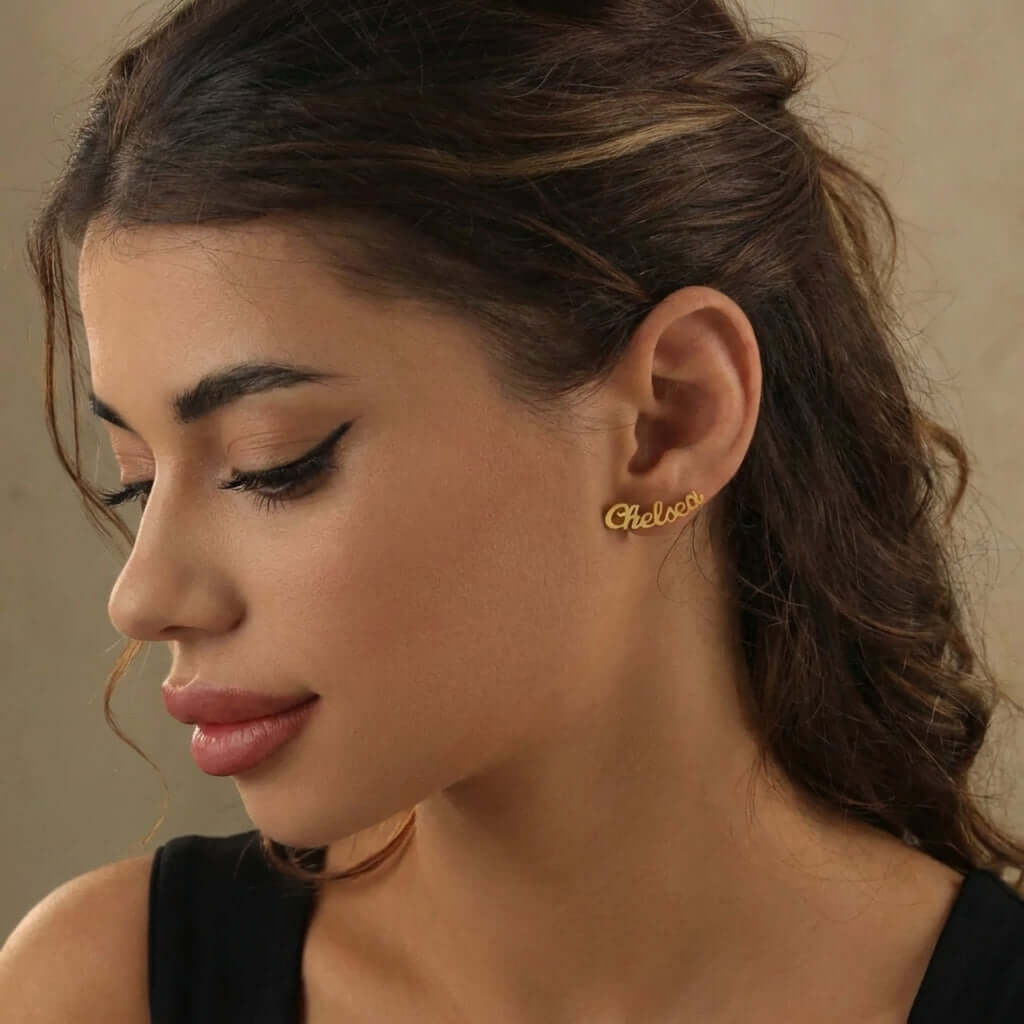 AUREATE Name Letter Stud Earrings showcased on a model, featuring a personalized design in gold.