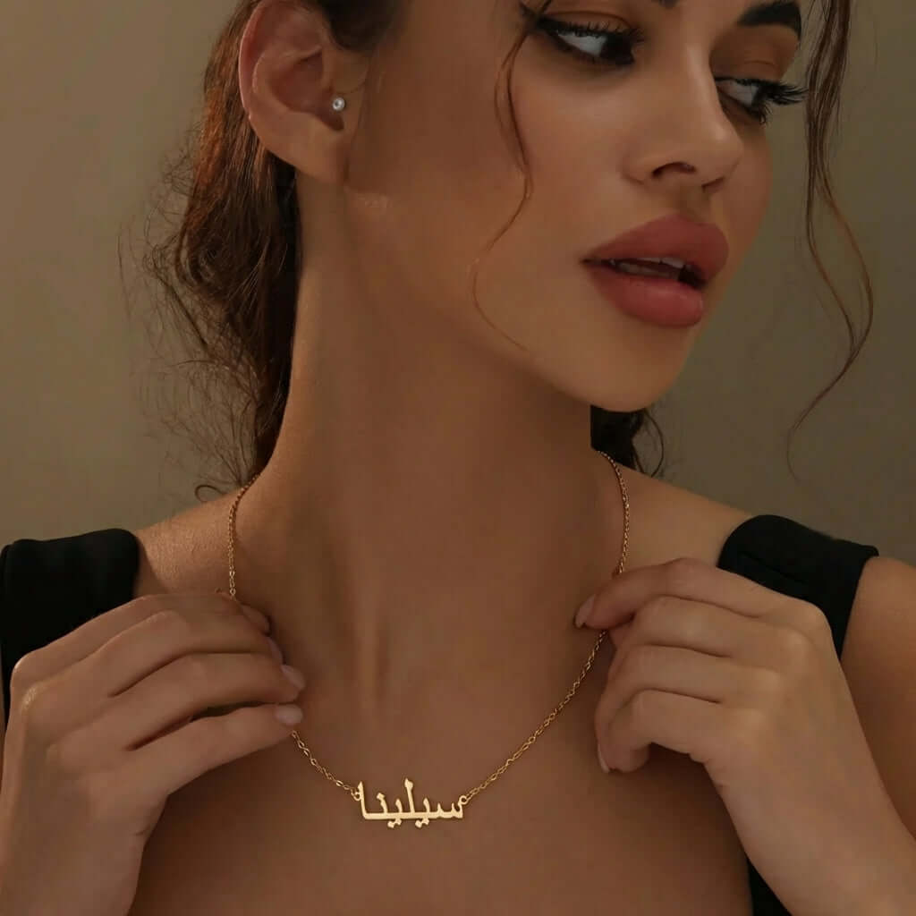 Arabic Style Name Necklace by AUREATE worn by a woman, showcasing personalized Arabic lettering.