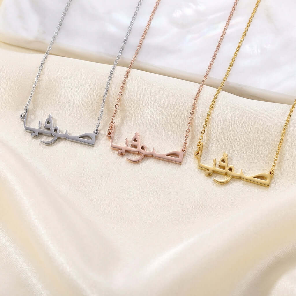 Arabic Style Name Necklace by AUREATE in silver, rose gold, and gold with Arabic inscription on each pendant.