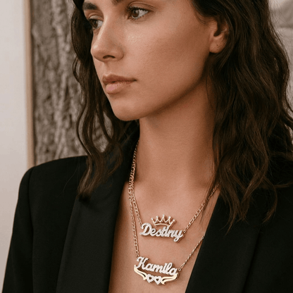 Double Plated Crown Name Necklace with Figaro Chain worn by a model showcasing custom names elegantly.