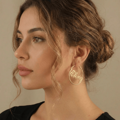 Script Name Hoop Earrings by AUREATE, personalized gold earrings featuring the name Ebony in cursive design.