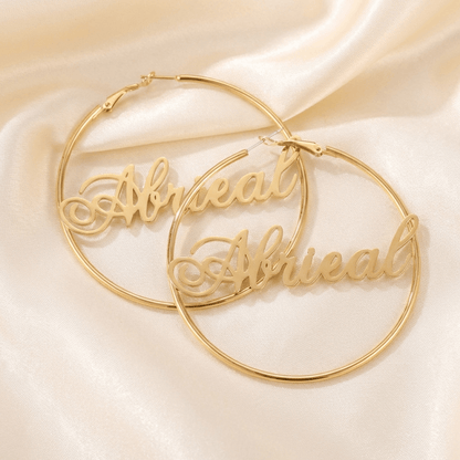 Script Name Hoop Earrings by AUREATE, featuring personalized golden hoops with a flowing cursive design.