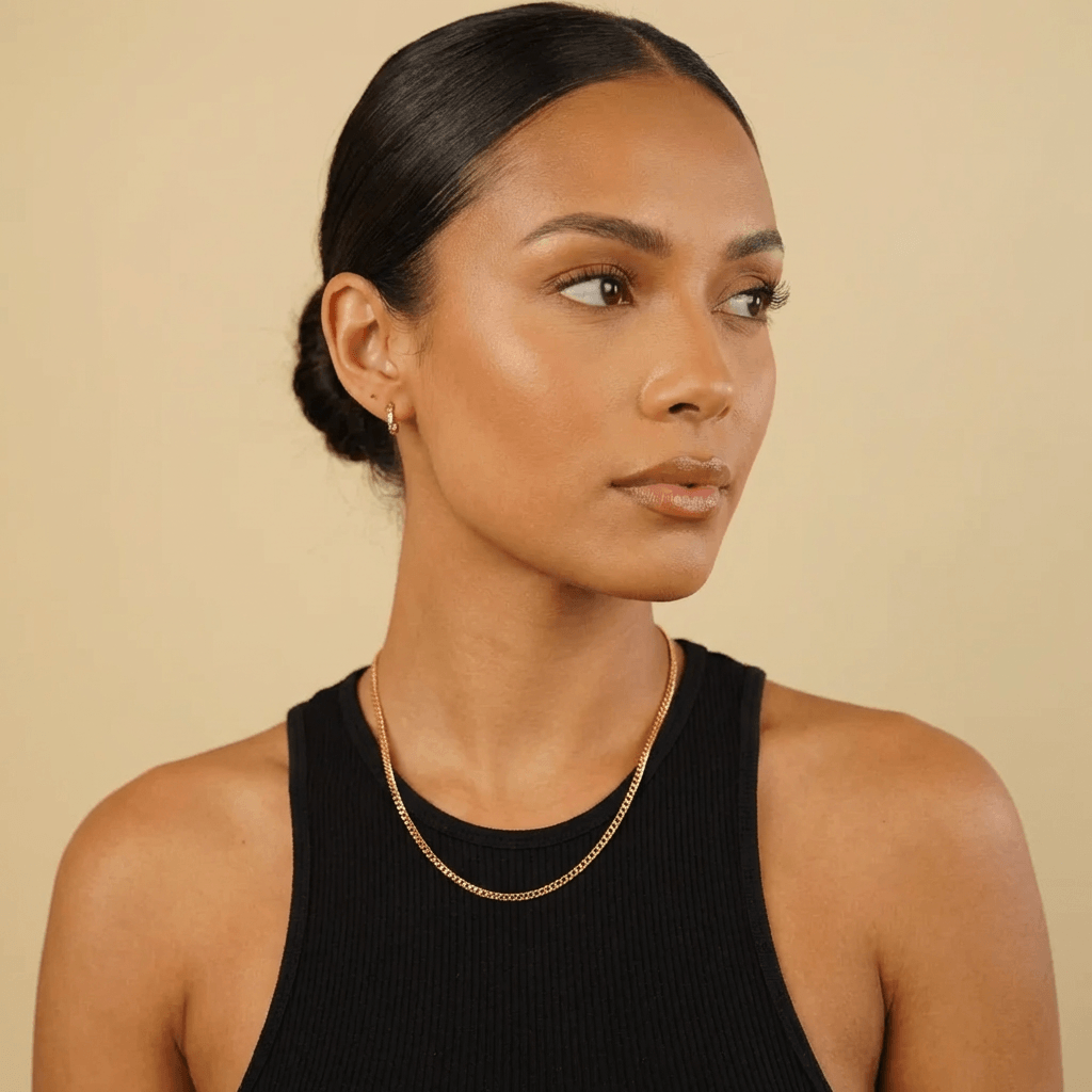 AUREATE 3mm Cuban Link Chain worn by a woman in a black tank top, showcasing elegance and style.