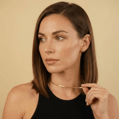 Model showcasing the elegant AUREATE 3mm Cuban Link Chain necklace, perfect for everyday wear.