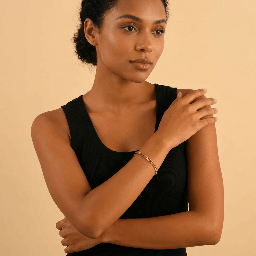 AUREATE 5mm Cuban Link Bracelet worn on a woman's wrist, showcasing elegant design and versatility.