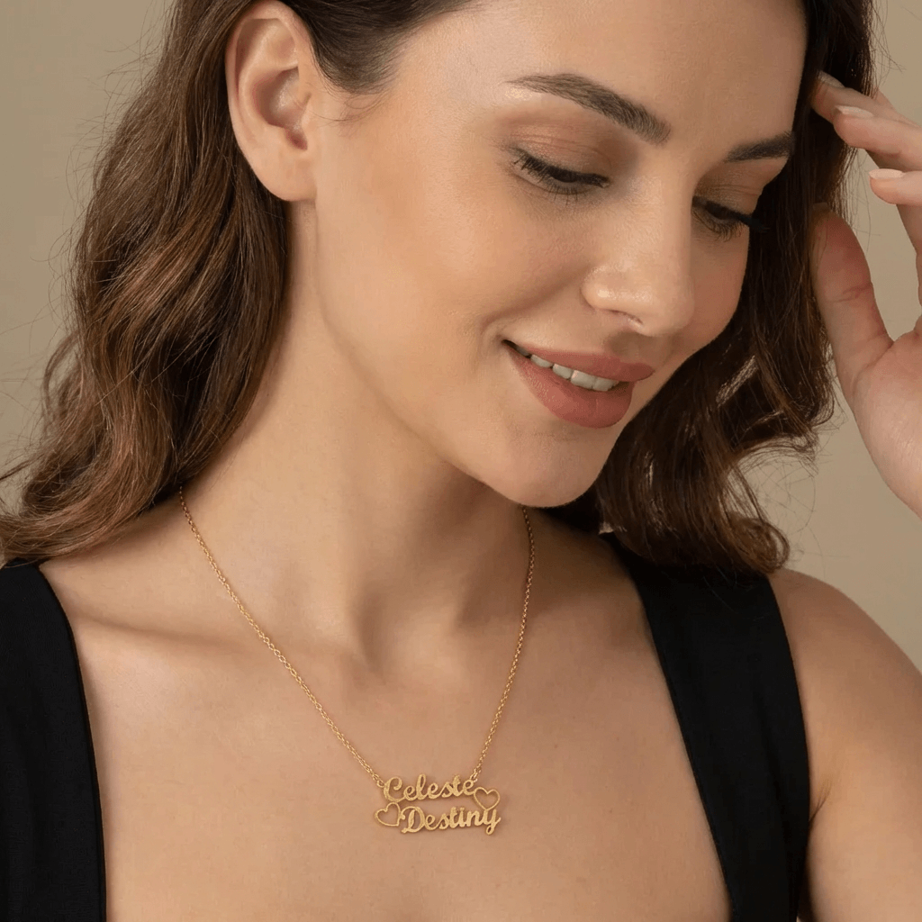 AUREATE Two Name Necklace worn by a smiling woman, showcasing personalized names Celeste and Destiny.