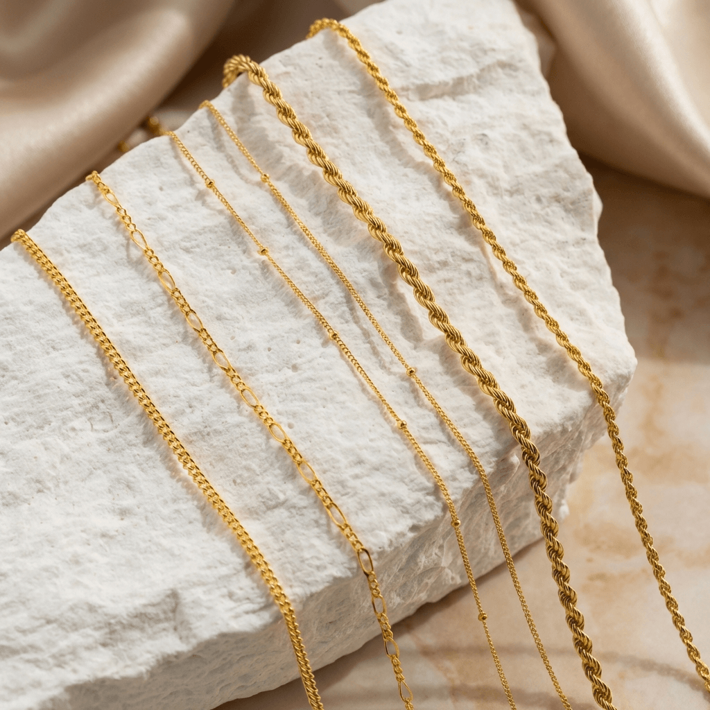 AUREATE 2mm Rope Chain Necklace displayed on a textured stone surface, showcasing its elegant design.