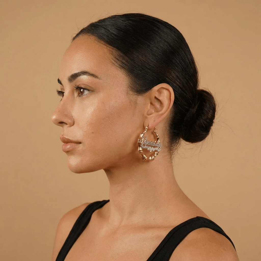 Model showcasing Double Plated Bamboo Name Hoops from AUREATE, featuring personalized engraved design.