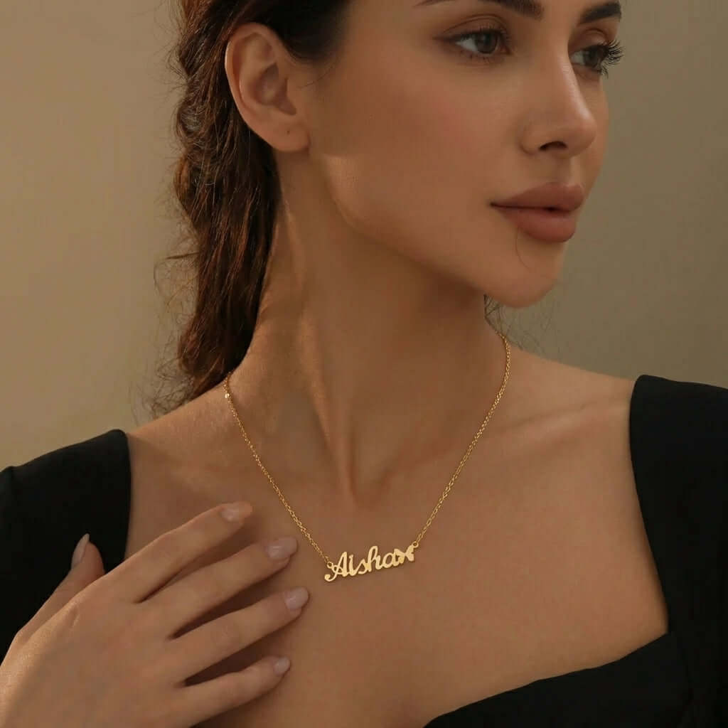 Butterfly Personalised Name Necklace worn by a model showcasing golden name design by AUREATE.