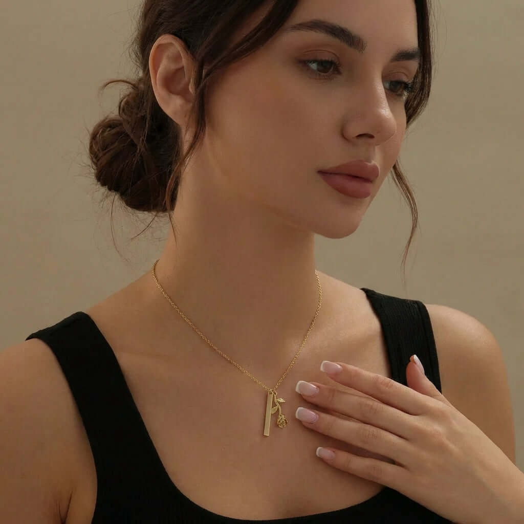 Rose Bar Necklace with Engraving worn by a model, showcasing AUREATE's elegant design and botanical theme.