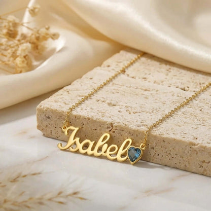 Birthstone Personalised Name Necklace by AUREATE featuring a golden nameplate with a blue heart-shaped birthstone.