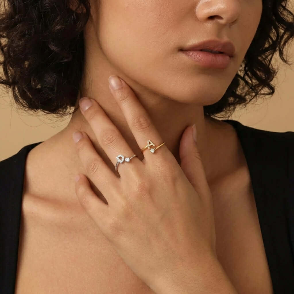 Iced Initial Signet Ring worn on fingers, showcasing modern design by AUREATE, reflecting vintage elegance.