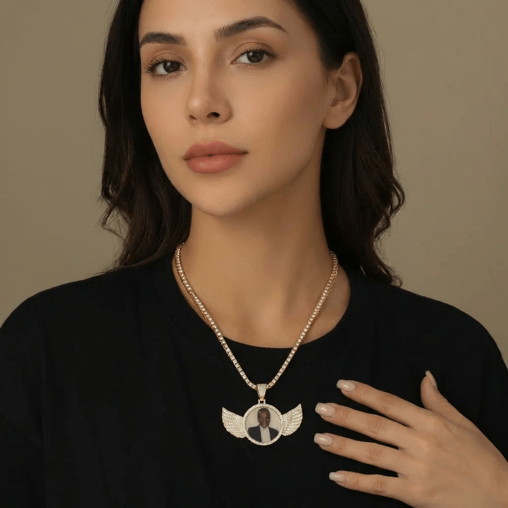 Iced Angel Photo Pendant Necklace worn by a model, featuring an angel-wing design by AUREATE.