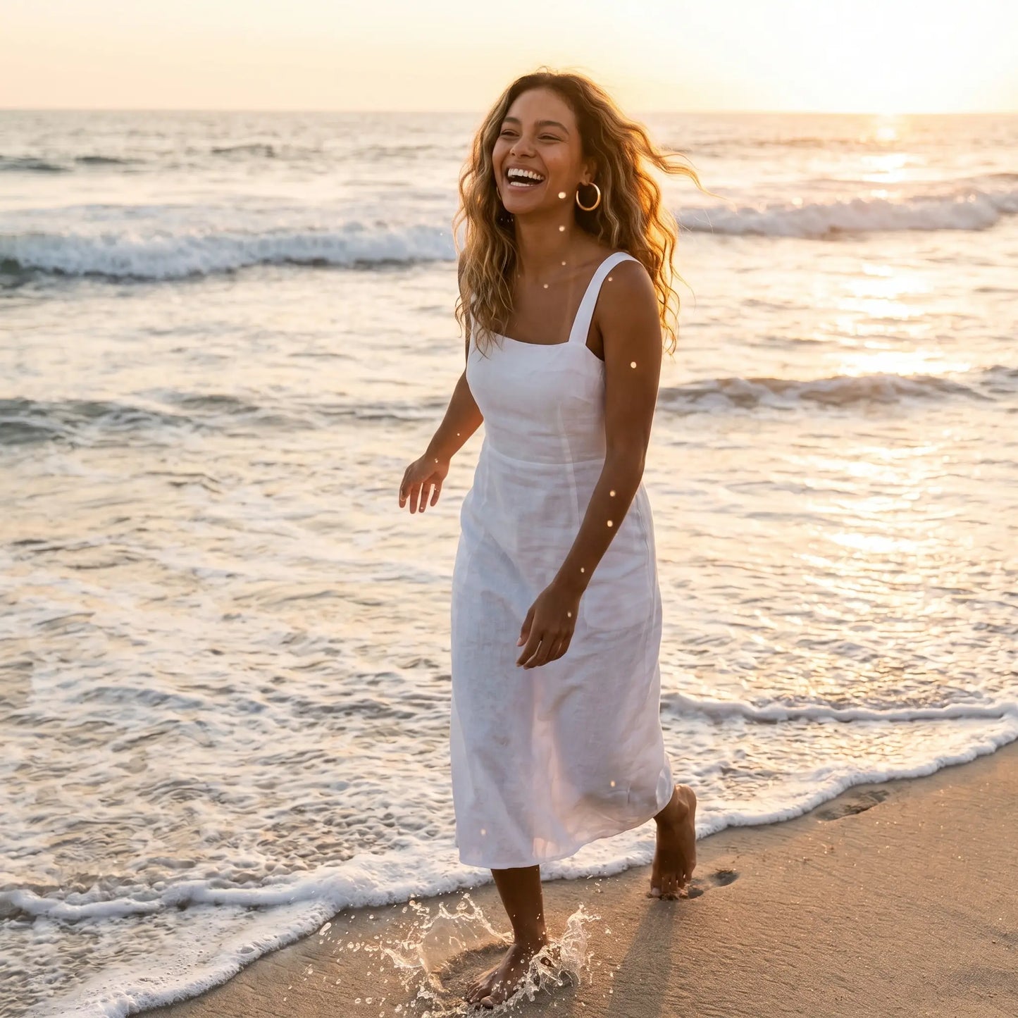 Woman on beach wearing Chunky Gold Hoop Earrings - waterproof sunset lifestyle