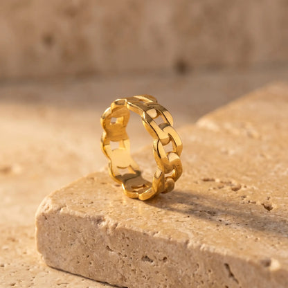 Cuban Link Gold Band Ring - product packshot on stone surface