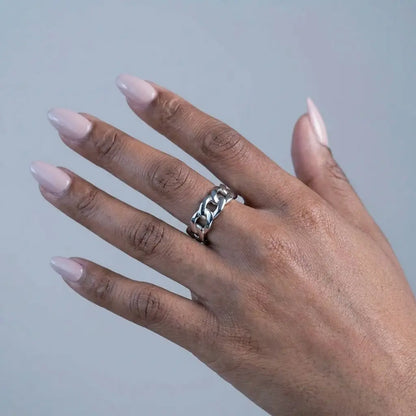 Woman wearing Silver Cuban Link Band Ring - studio close-up editorial