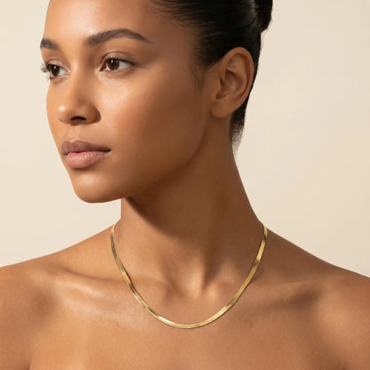 AUREATE 5mm Herringbone gold chain studio profile portrait