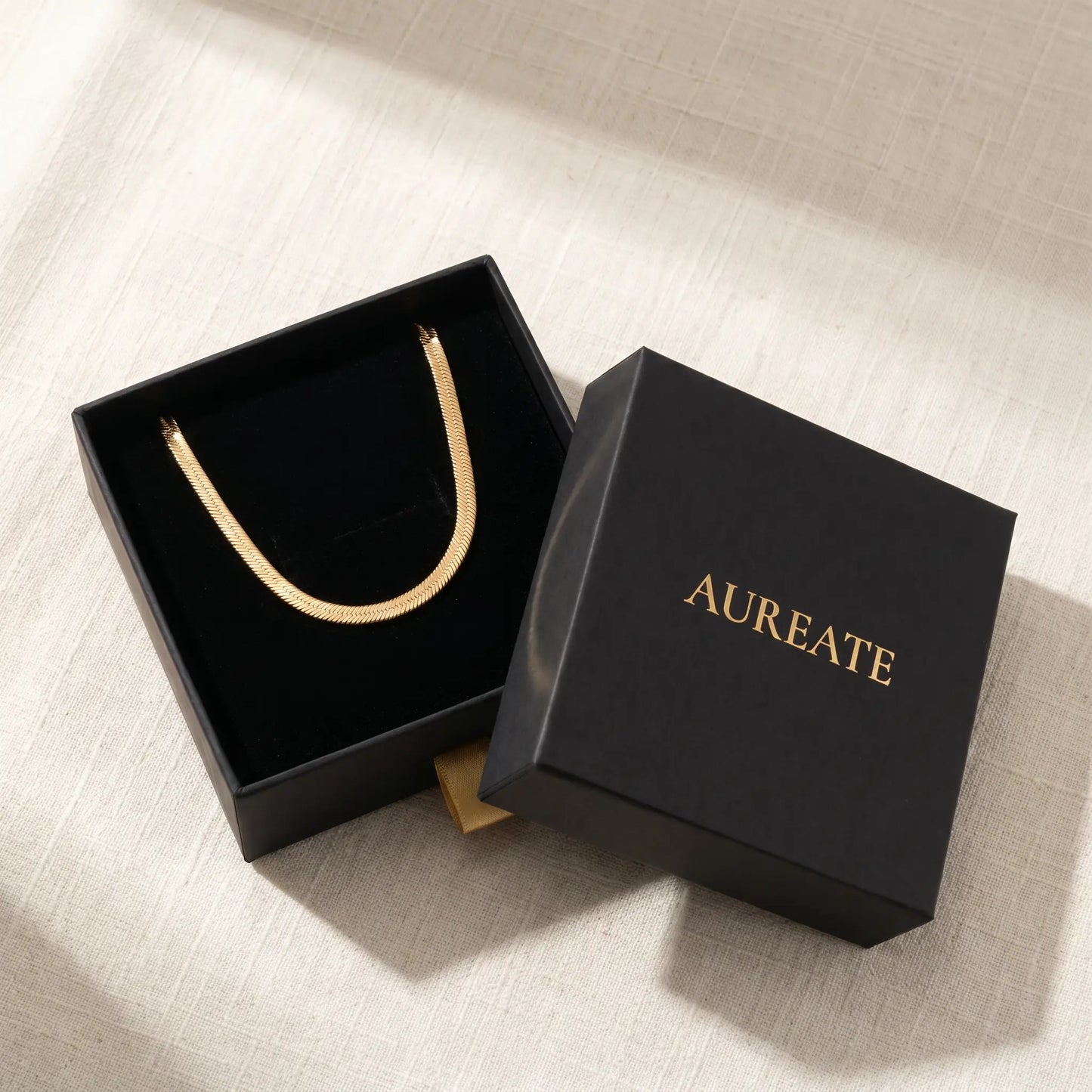 AUREATE 5mm Herringbone gold chain in matte black gift box with logo