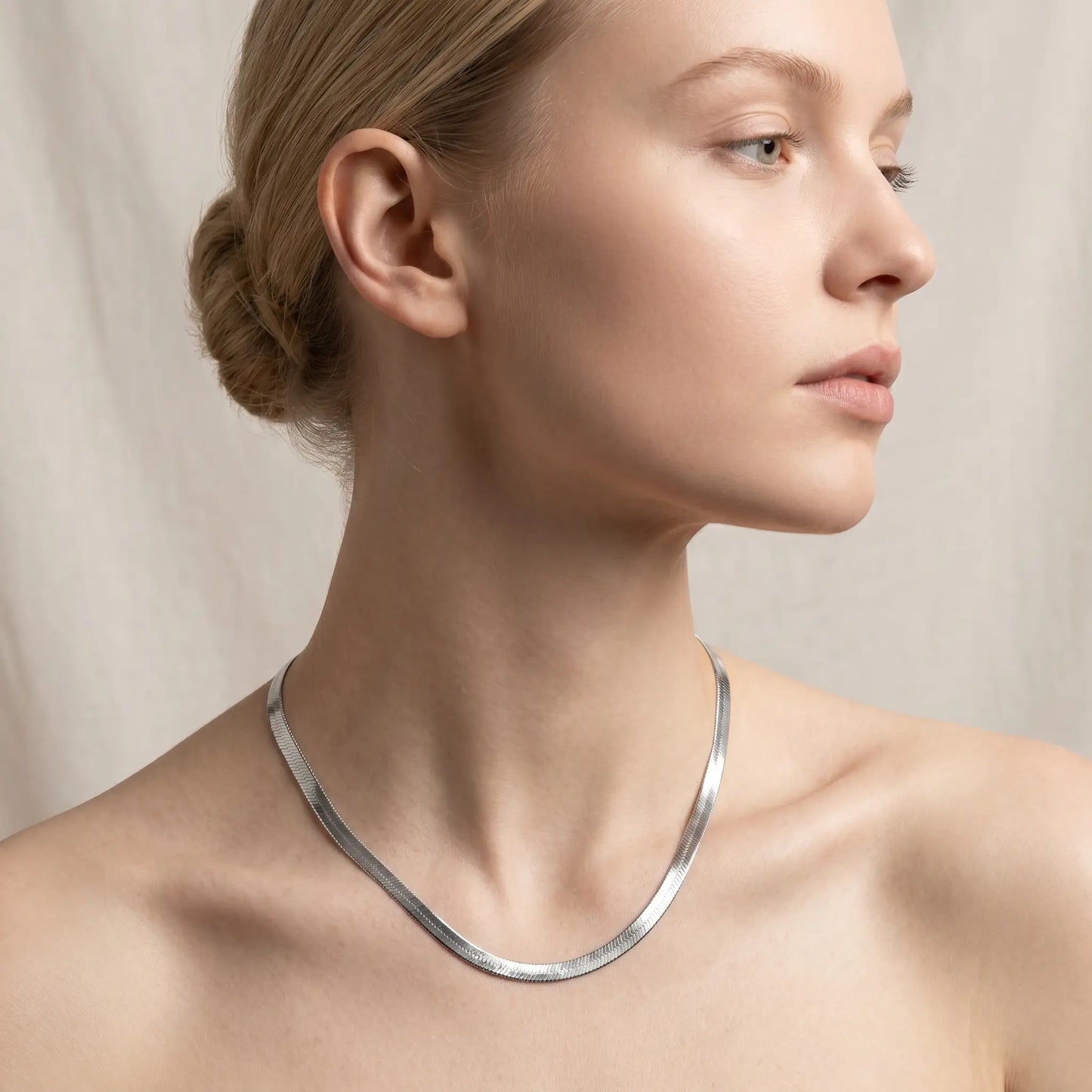 AUREATE 5mm Herringbone silver chain studio profile portrait