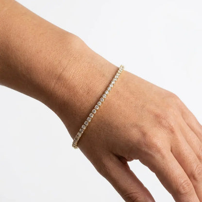 Classic Gold Tennis Bracelet on wrist - studio featured