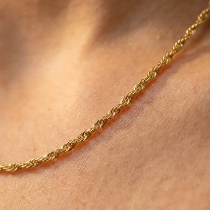 2mm Singapore Twist Chain gold macro collarbone detail