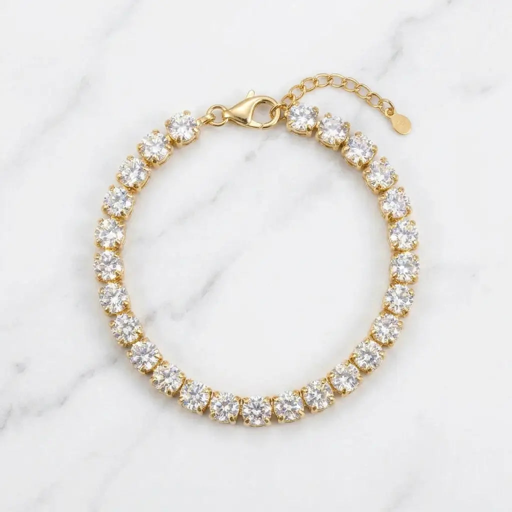 Classic Gold Tennis Bracelet - gold flat lay marble
