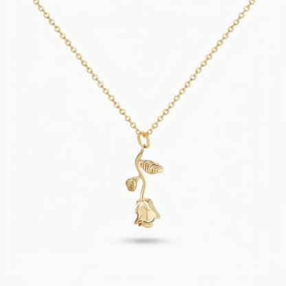 AUREATE Rose Flower Charm Pendant 18K Gold packshot — 3D sculpted long-stem rose with two leaves on a delicate cable chain, isolated on clean white background.