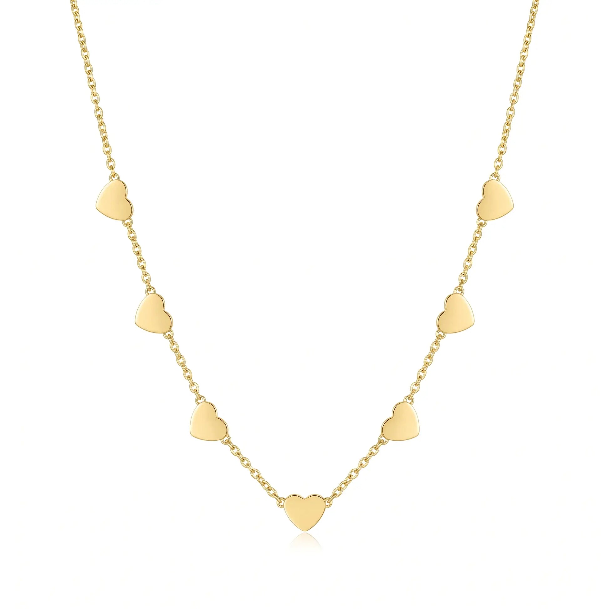 AUREATE Twin Heart Gold Multi-Heart Station Necklace 18K gold packshot studio editorial 7 hearts station chain