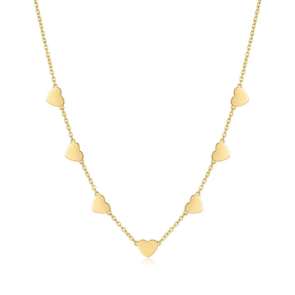 AUREATE Twin Heart Gold Multi-Heart Station Necklace 18K gold packshot studio editorial 7 hearts station chain