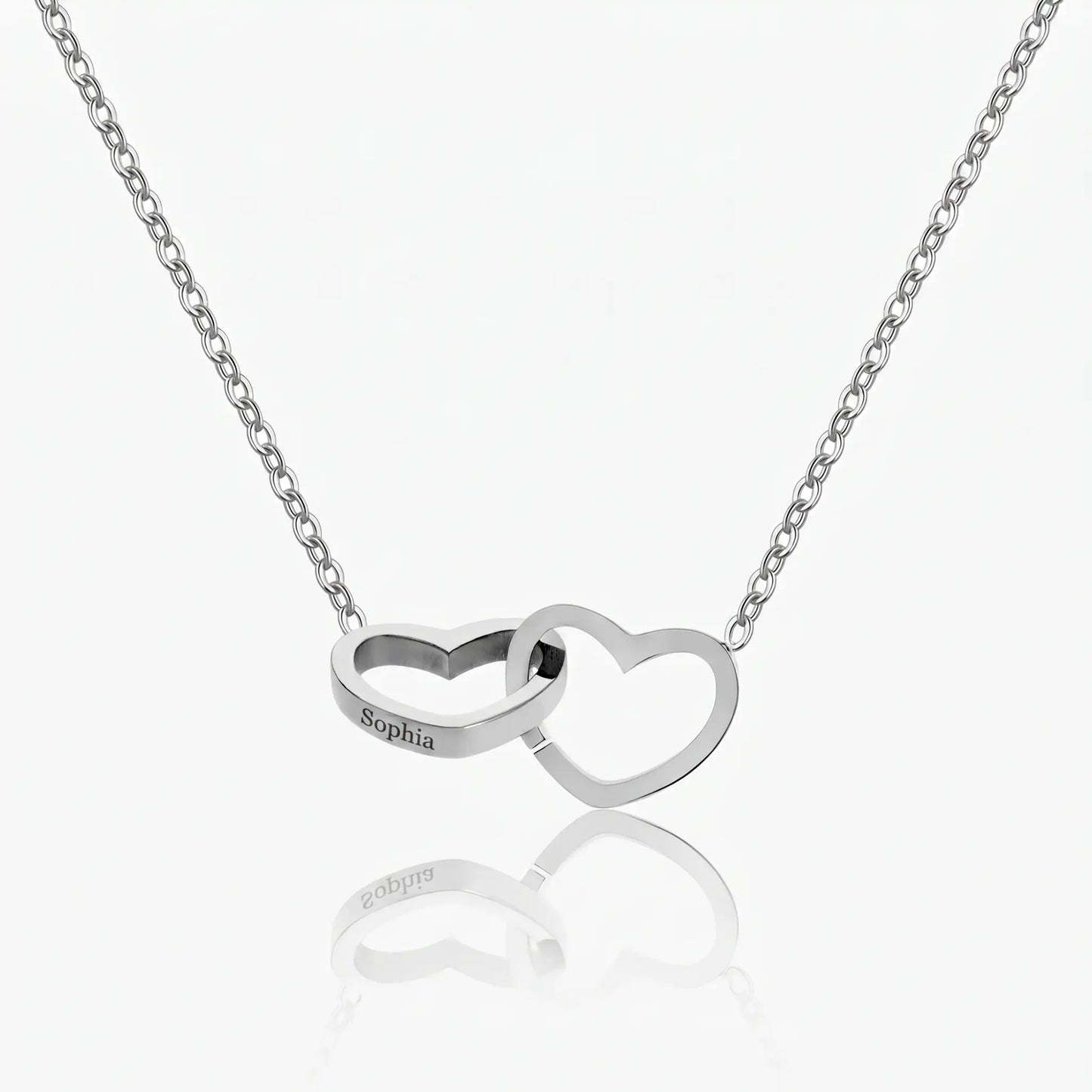 Engraved Double Heart Pendant Silver Stainless Steel packshot by AUREATE, two interlocked hearts on delicate cable chain Sophia engraved on left heart