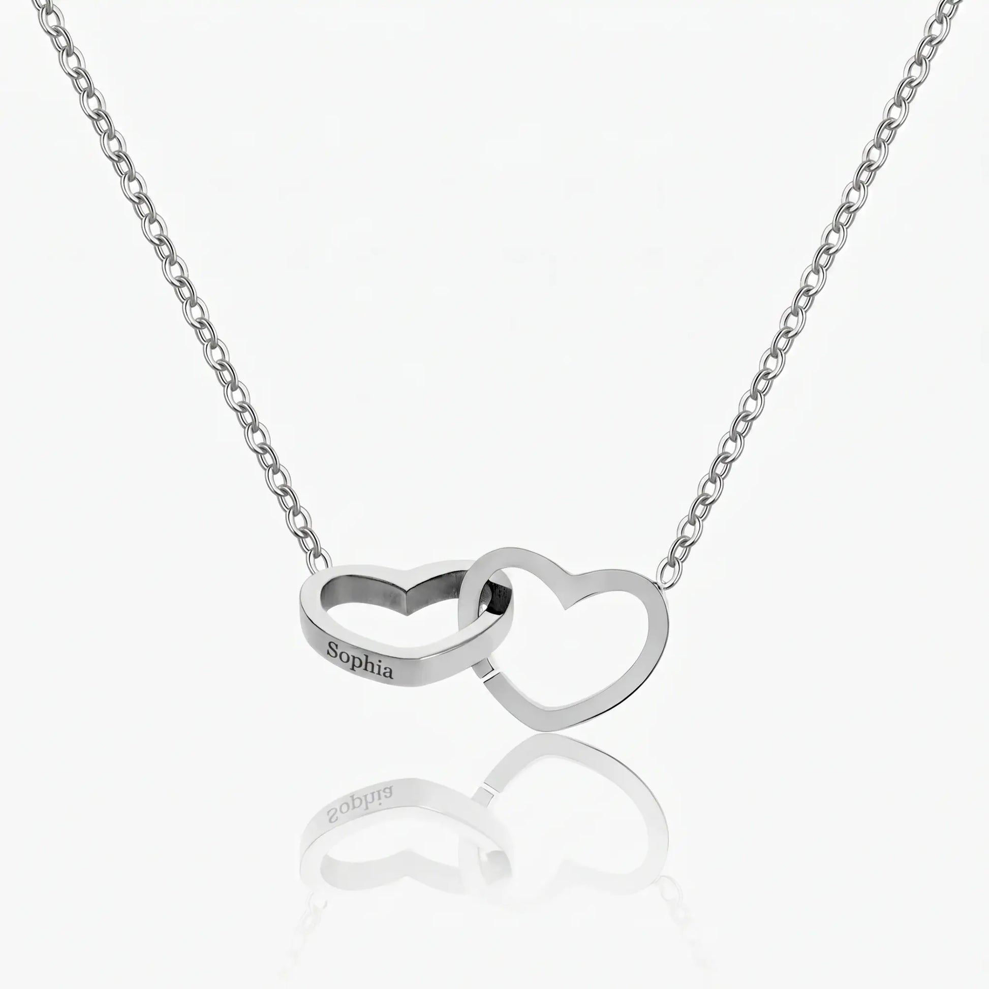 Engraved Double Heart Pendant Silver Stainless Steel packshot by AUREATE, two interlocked hearts on delicate cable chain Sophia engraved on left heart