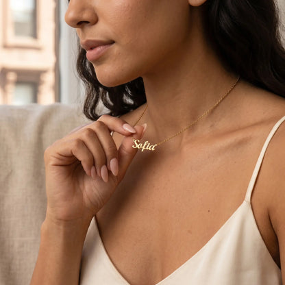 Personalized Script Name Chain 18K gold tender hand to jewelry intimate moment by AUREATE