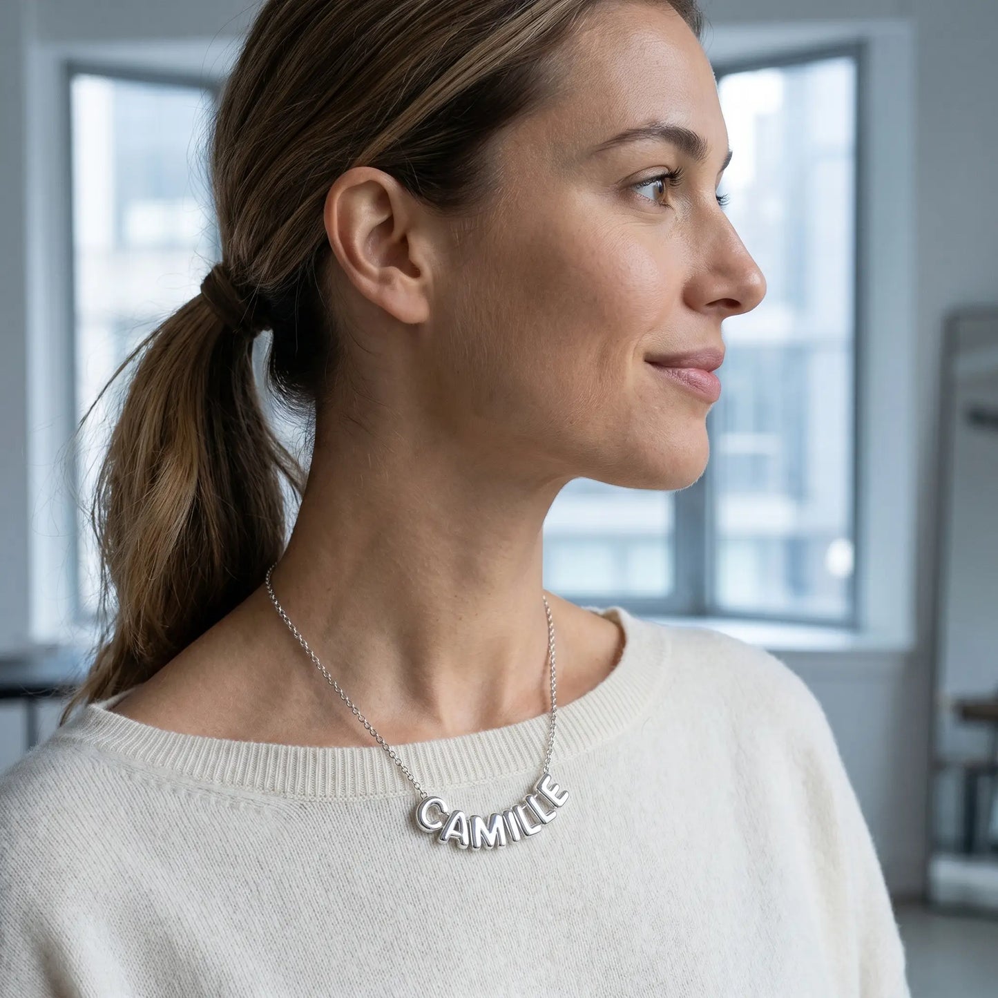 AUREATE Bubble Letter Name Chain Silver Tone CAMILLE profile subtle smile editorial NYC loft