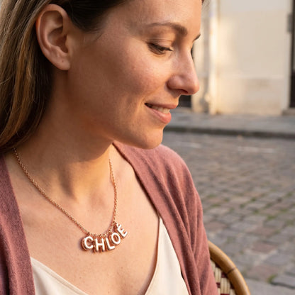 AUREATE Bubble Letter Name Chain Rose Gold CHLOÉ profile subtle smile editorial Parisian terrace