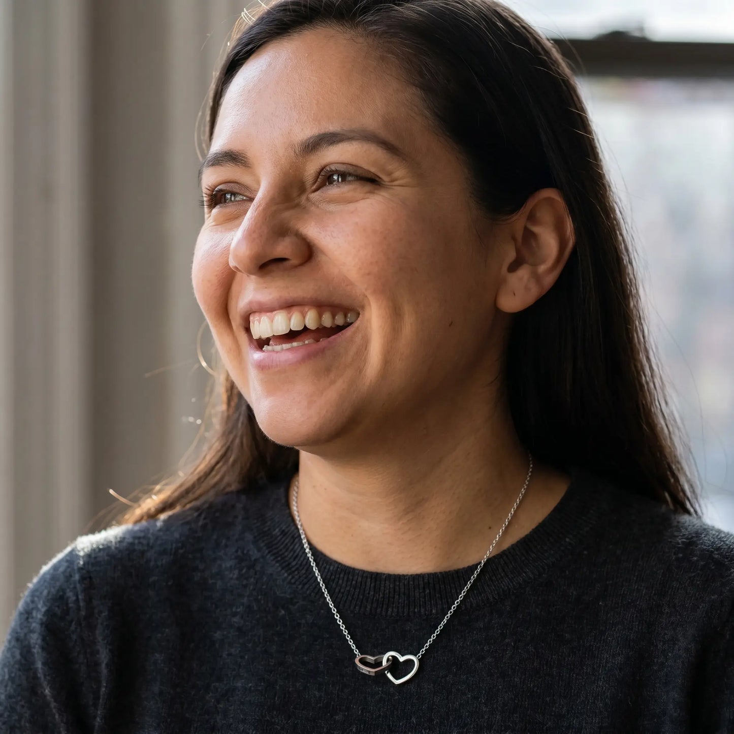 Engraved Double Heart Pendant Silver candid laughter Mexican woman charcoal merino crewneck NYC bay window light by AUREATE