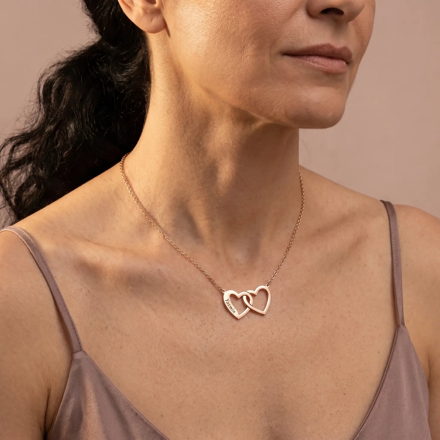 Engraved Double Heart Pendant Rose Gold worn 3/4 profile Persian mature woman dusty rose silk camisole romantic elegance by AUREATE