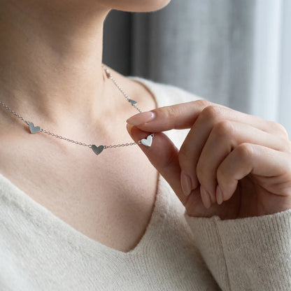 AUREATE Twin Heart Silver Multi-Heart Station Necklace stainless steel tender hand-to-jewelry close-up Korean woman
