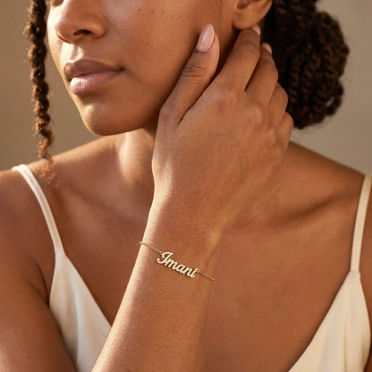 Crystal Name Wrist Chain in 18K Gold worn on wrist - dainty cursive crystal pave personalised name bracelet by AUREATE