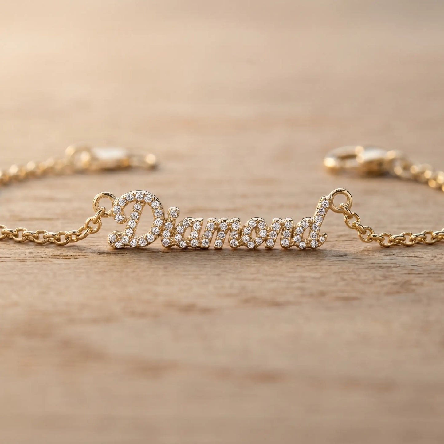 Crystal Name Wrist Chain in 18K Gold macro detail - extreme close-up of dainty pave crystals by AUREATE