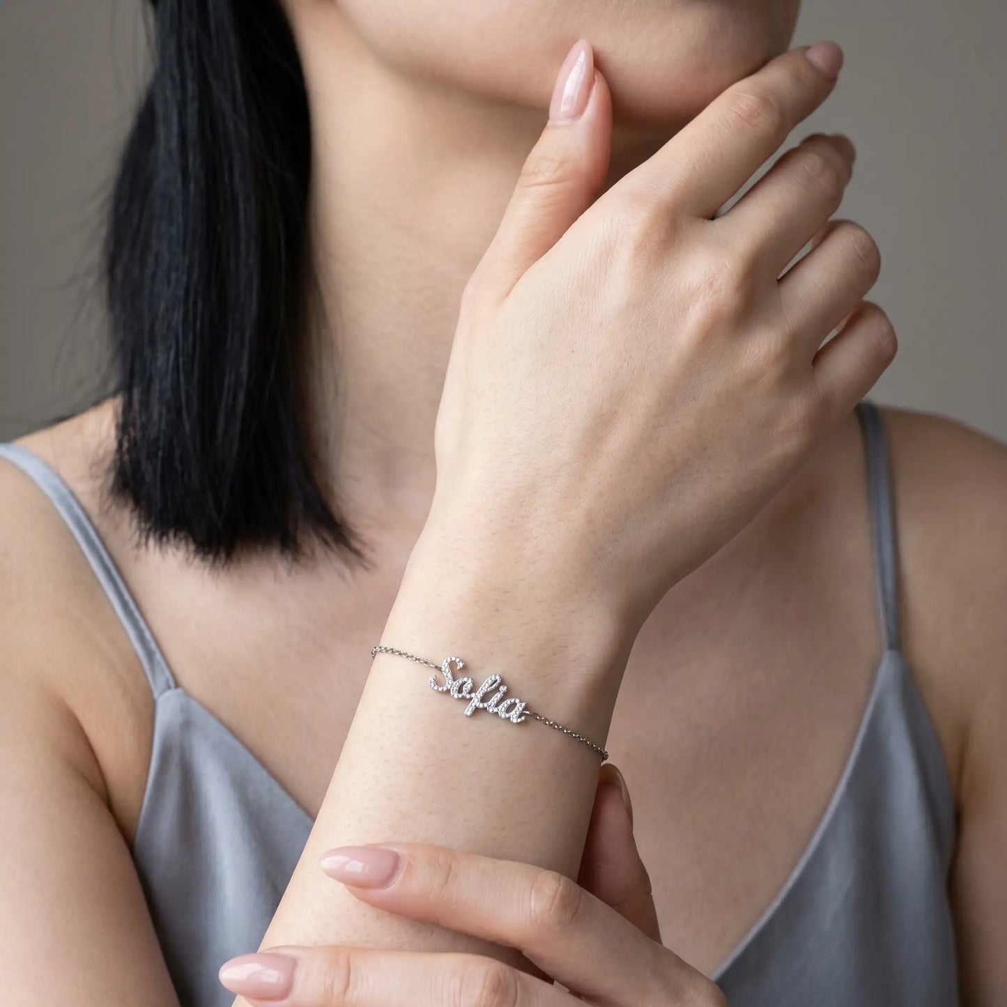 Crystal Name Wrist Chain in Silver worn on wrist - dainty cursive crystal pave personalised name bracelet by AUREATE